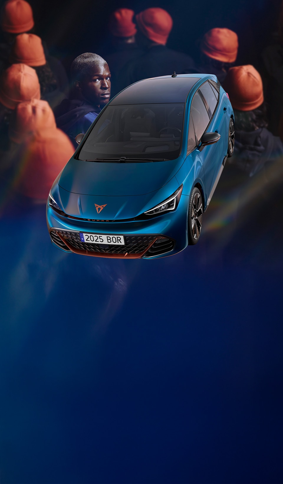 A CUPRA Formentor CUV suspended diagonally, next to a rocky, cliff-like structure. A charging cable is connected to the car from a charging unit on the cliff face.