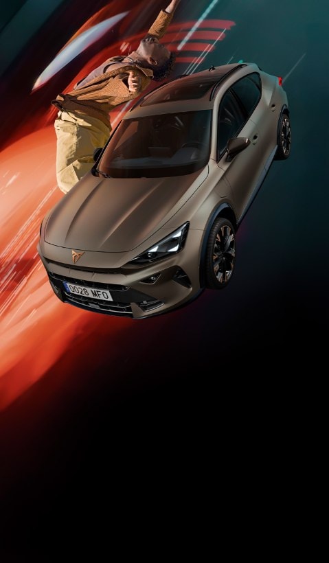 A CUPRA Terramar SUV shown from a high angle, appearing to be in motion with a red light streak extending from its side to a person lying horizontally in the air next to it.